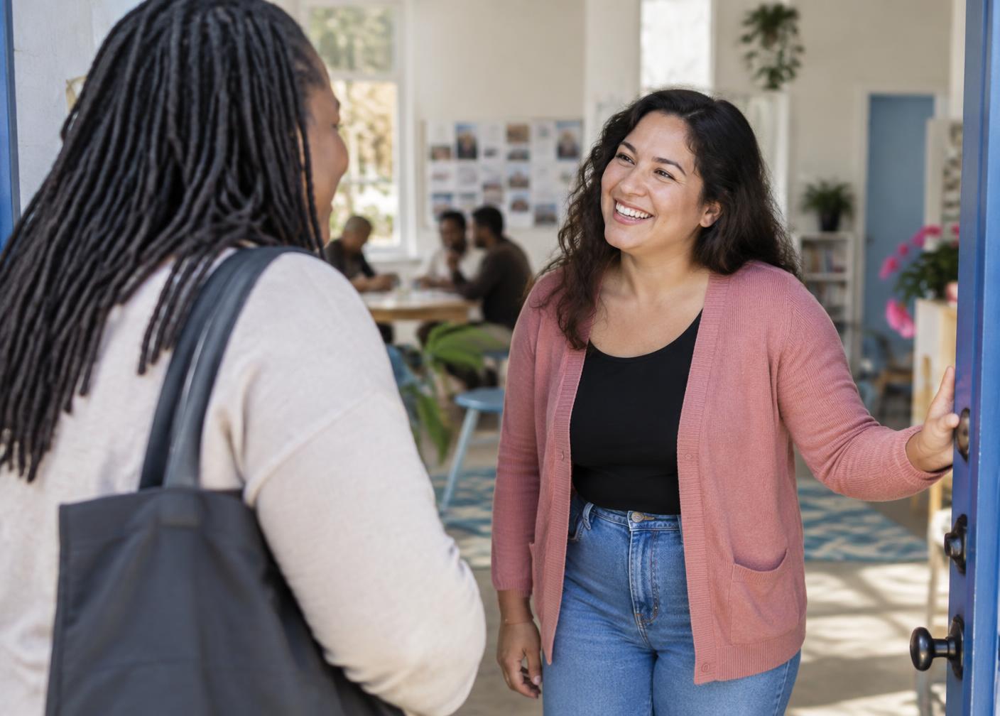 A warm welcome at an open community center door